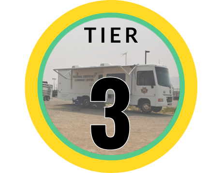 The words Tier 3 overlaid on an image of the WCRAS emergency Evacuation command center motorhome vehicle