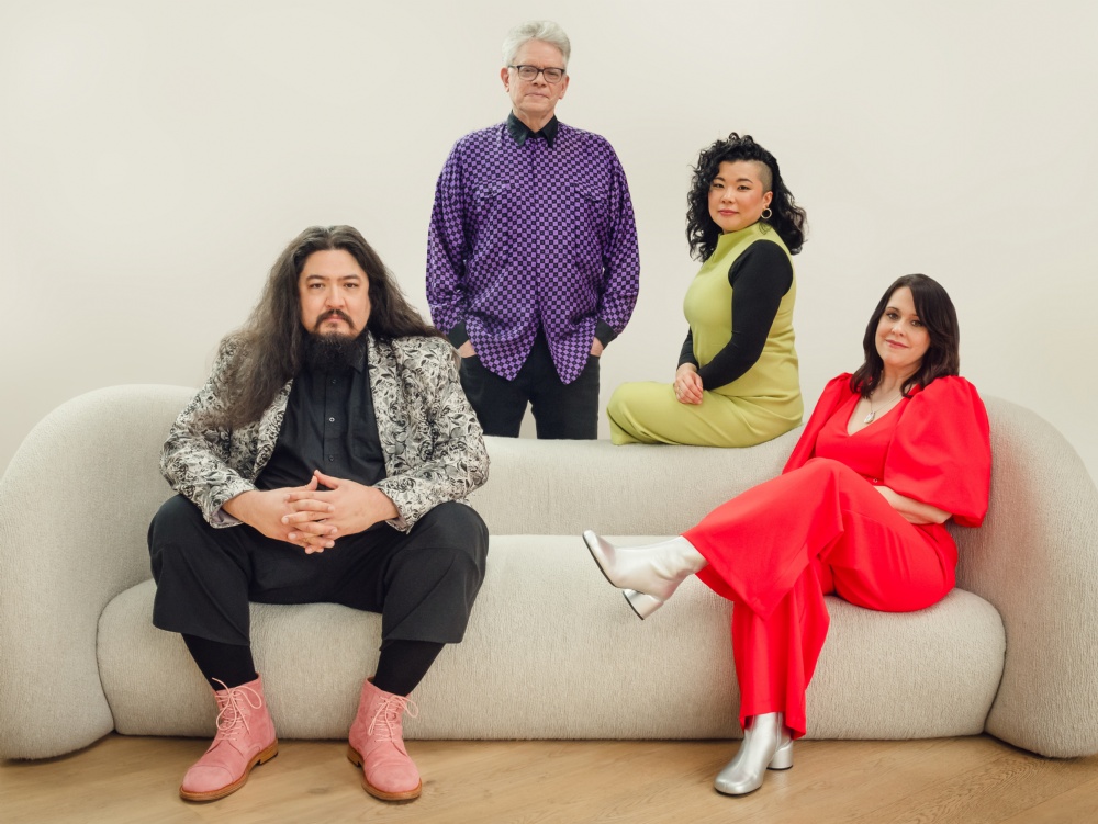 The band Kronos Quartet sitting on a couch