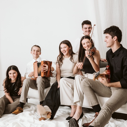 Photo of the band sitting down